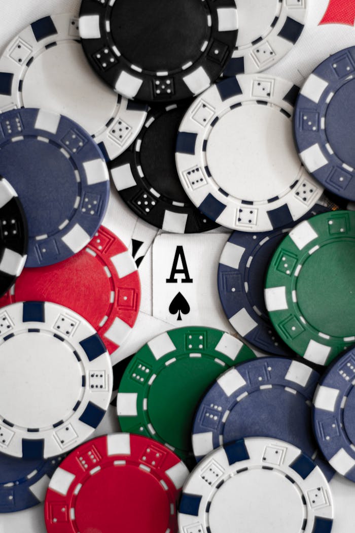 services-05 Close-up of poker chips with an ace of spades card, perfect for casino themes.